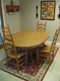 Solid wood clawfoot kitchen table and 4 ladderback chairs.