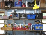 3 rows items: Books (some western), Motor oil, vintage gas can, pliers, fuel injector cleaner, etc.