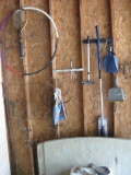 Items on wall: badminton racket, hula hoop, dustpans