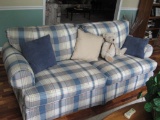 Plaid sofa and Love Seat w/ pillows and bear.