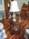 Round side table and items on table. Table: 27