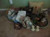 All items on floor-candlesticks, frames, baskets, pillows, light bulbs, birdbath for a table.