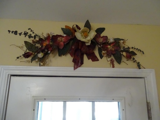 Floral arrangement over door