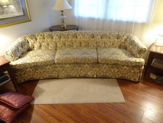 Large Curved Floral Brocade Sofa. 98"L x 34"D x 29"H. Good condition.