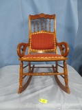 ANTIQUE ROCKER W/ RED UPHOLSTERY