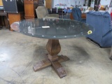 ROUND DINING TABLE W/ ORNATE BASE- HAS A GLASS PC ON TOP