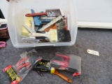 Misc. bin full of paint brushes