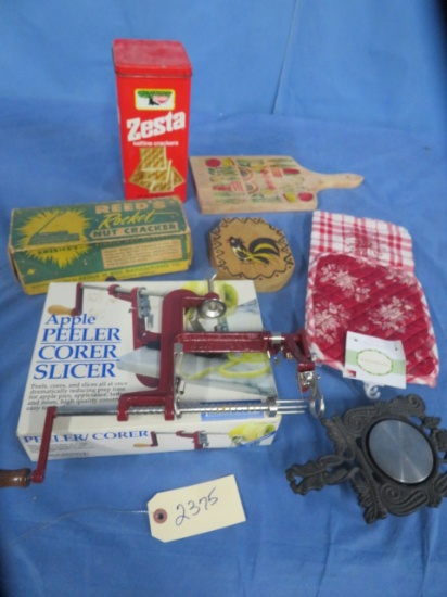 APPLE PEELER, METAL CRACKER TIN, NUT CRACKER, CUTTING BOARD AND KITCHEN TOWELS