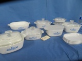 LARGE AMOUNT OF CORNINGWARE DISHES W/ SOME LIDS- 1 LID IS CRACKED
