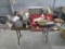 4 FT. FOLDING TABLE W/ MISC. ON TOP