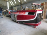 COUNTER ON WHEELS MADE FROM RV BODY  W/ SLIDING DOORS ON BACK AND STAINLESS TOP