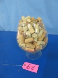 GLASS CONTAINER OF WINE CORKS