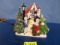 LIGHTED AND MUSICAL CAROLER FIGURINE   12 X 13