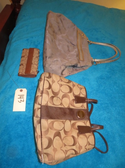 2 LADIES PURSES MARKED COACH AND ONE WALLET