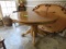 ROUND OAK DINING TABLE W/ CLAW FT.