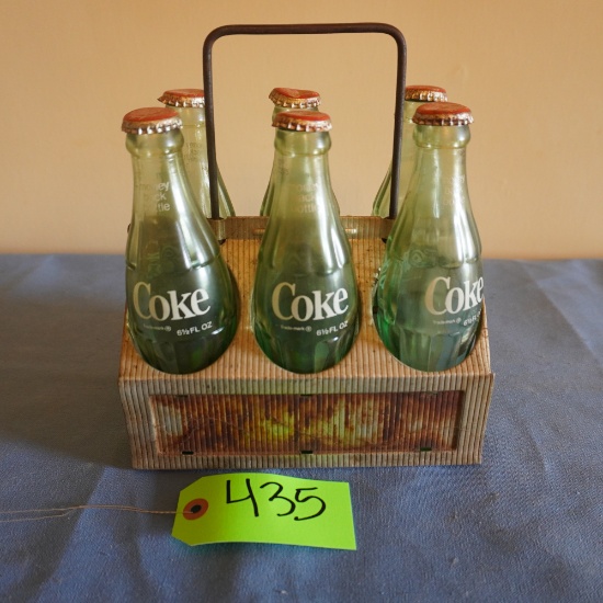 OLD COKE BOTTLES IN OLD METAL CRATE