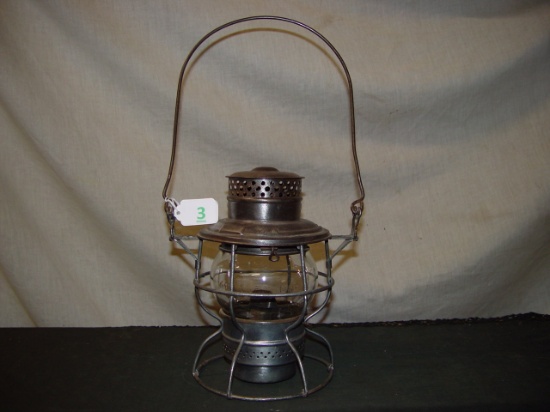 RR lantern marked Rock Island. Short clear globe