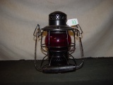 RR lantern marked CP. Wood handle. Short red globe