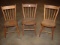 3 plank seat farm chairs with a few loose lower rungs. Local pickup only