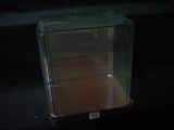 New glass display case. Mirror wall on back. Wood base. Approx size 12x12x10