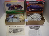 Model car kits. Hubley metal Model A and Ertl Corvette convertible . Boxes open as-is