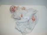 Bisque head marked “151” celluloid body baby doll 12” tall. Eyes are loose and In The Head.