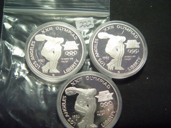 Three 1983 Proof Olympic Silver Dollars