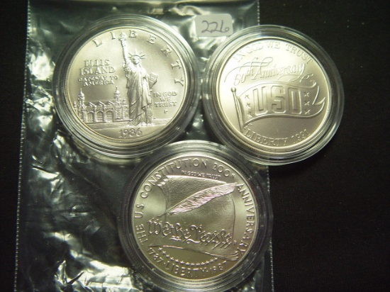 Three Different BU Silver Dollars: Statue of Liberty, USO, Constitution