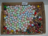 Clay and ceramic marbles shown in box 11’ x 8”