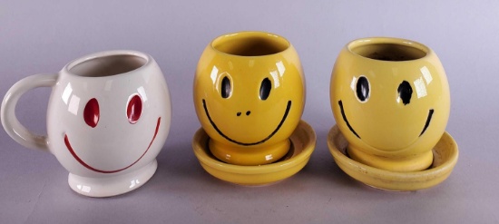 (2) McCoy Smile Pots & Saucers and (1) McCoy Smile Cup
