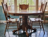 Oak Pedestal Table and (4) Pressed-back Chairs (LPO)