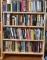 Assortment of Paper Back Books w/Shelf (LPO)