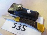 BUCK # 110 WITH SHEATH [WICKES LUMBER ADV. ON SIDE]