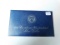 1973 SILVER IKE DOLLAR IN BLUE ENVELOPE BU