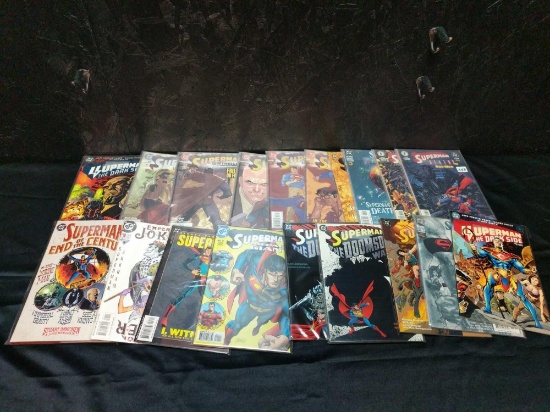 66 Superman comic books and 1 hard book