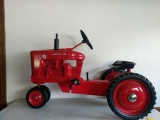 Farmall Super M pedal tractor signed by Joseph Ertl