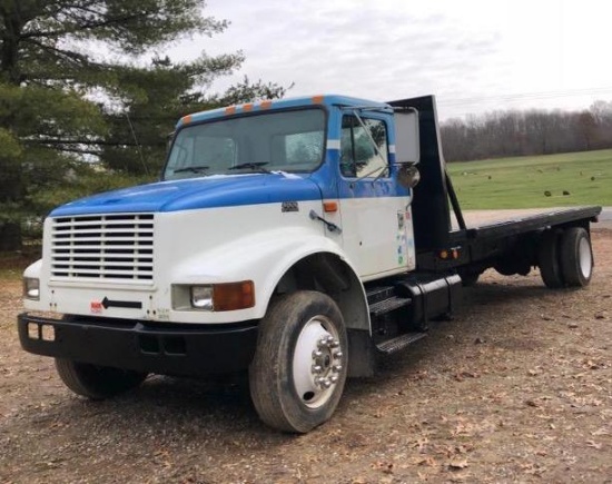 1999 International with 466 diesel engine with new 16 foot flatbed.