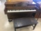 Hammond Piano mounted on casters, with bench