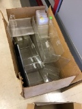 Large box of various plastic sign stands and shelves