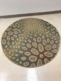 Round area rug, approx 58 inches across
