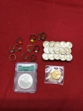 MS70 Silver Eagle, Nickel Belt Buckle, Various rings, and 2 $1.00 coins