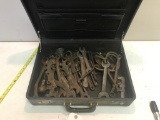 Case with several various vintage and farm wrenches