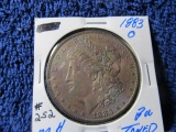 1883O MORGAN DOLLAR (COLORFUL TONING) BU