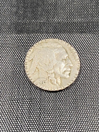 1937 Buffalo Nickel, with various nicks on the rim