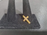 Gold Cross, back is marked Black Hills Gold J Co. 10K 12K, weighs .97 grams total