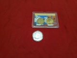 Trump election token and 2 US Dollar coins