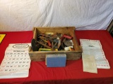 Wooden box with assorted tools and hardware, and calendar