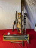 Tile Cutter, Pruners, levels, and hammer