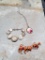 2 dog pins, a braclet, 1 necklace sterling charm