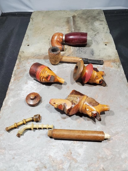 3 Carved faces, corn cob looking pipe cracked Missour Meershaum, and assorted pieces and parts